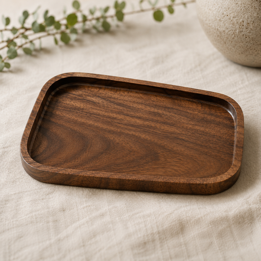 Empty handmade walnut valet tray showing the natural wood grain