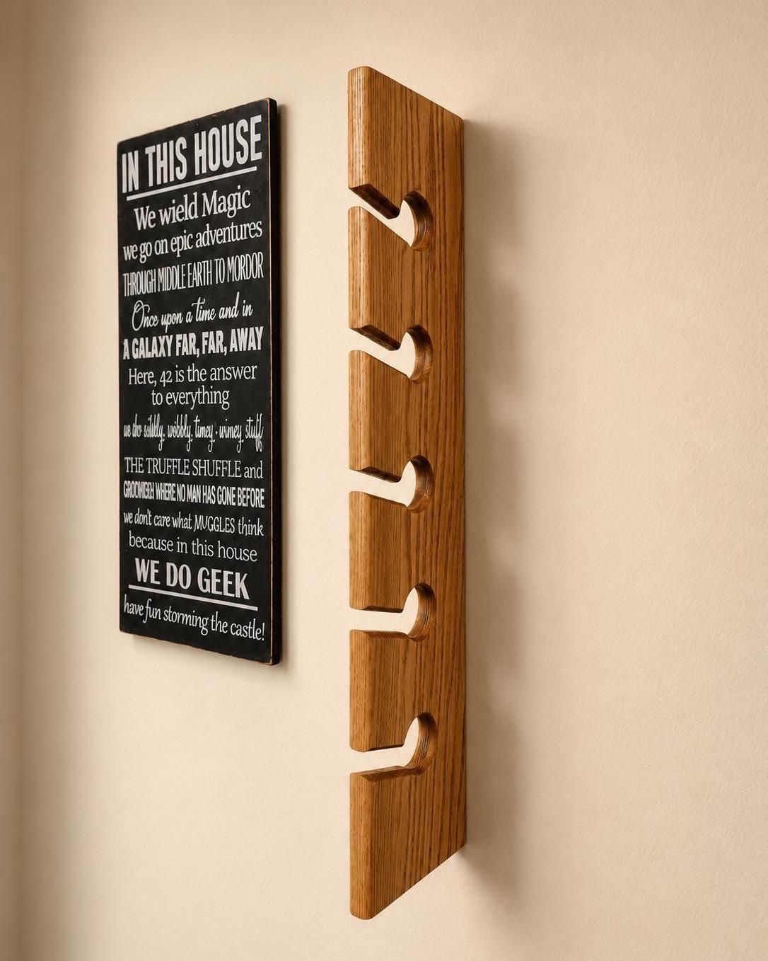 Side view of the oak hat rack showing its routed cap holders