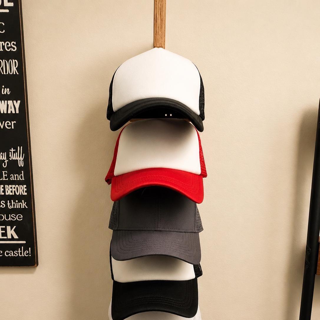 Baseball caps stored vertically on the handmade oak hat rack