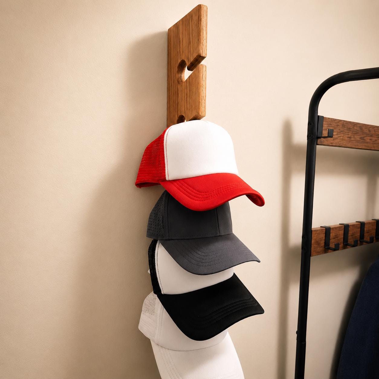 Handmade wooden hat rack mounted on a wall with baseball caps